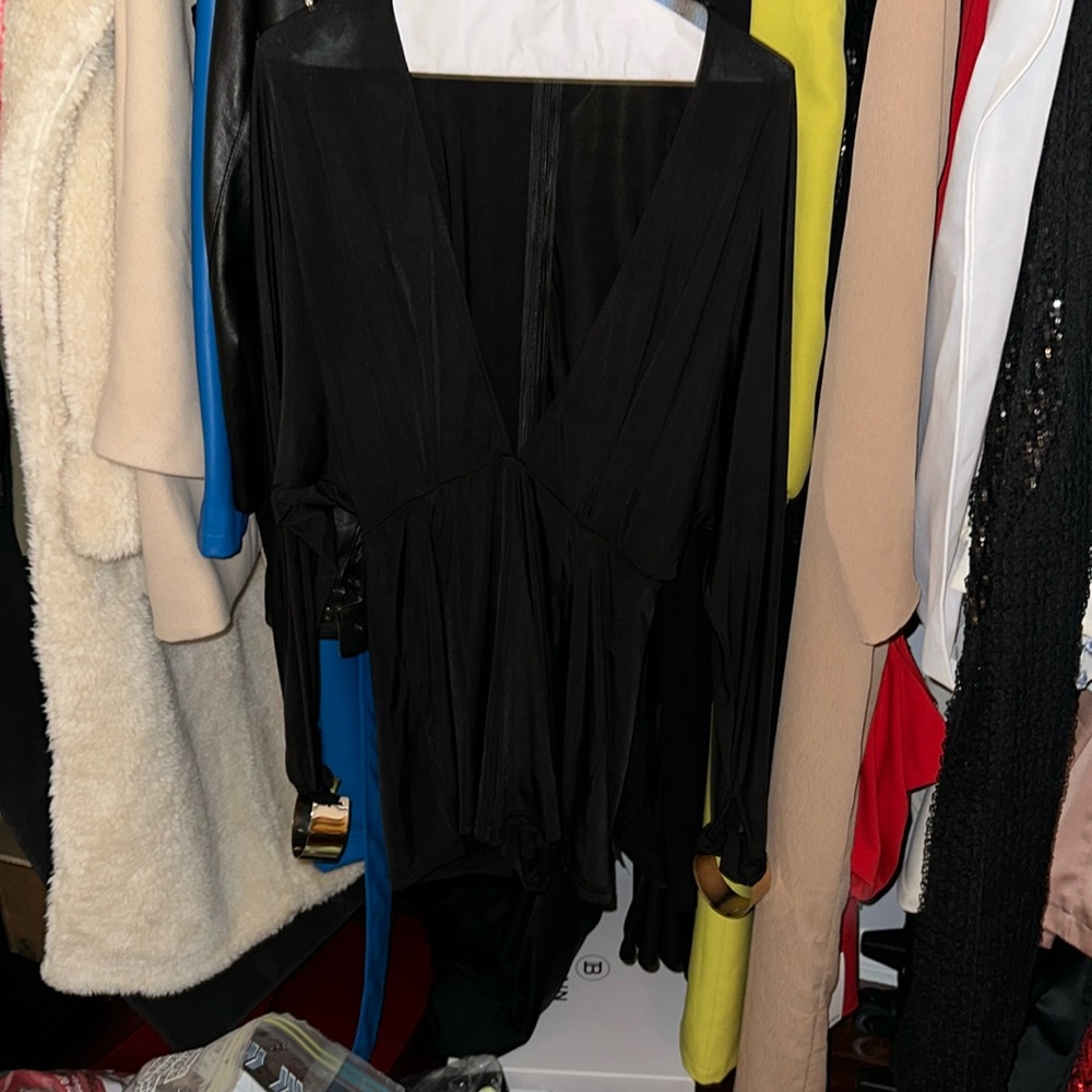 Misguided sexy black romper with gold cuffs at the end of the sleeves. UK size12